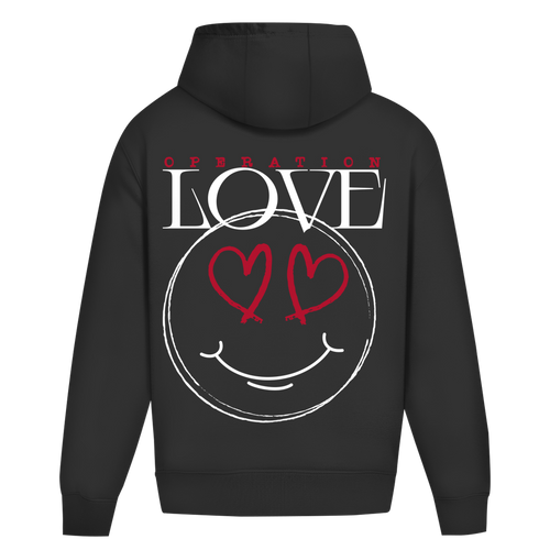 Der State Your Mind Oversize Hoodie Operation Love Black zeigt einen auffälligen Rückenprint mit "OPERATION LOVE" und einem handgezeichneten Smiley-Gesicht mit Herzaugen in auffälligem Weiß und Rot - ein auffälliges Stück für Streetwear-Fans.