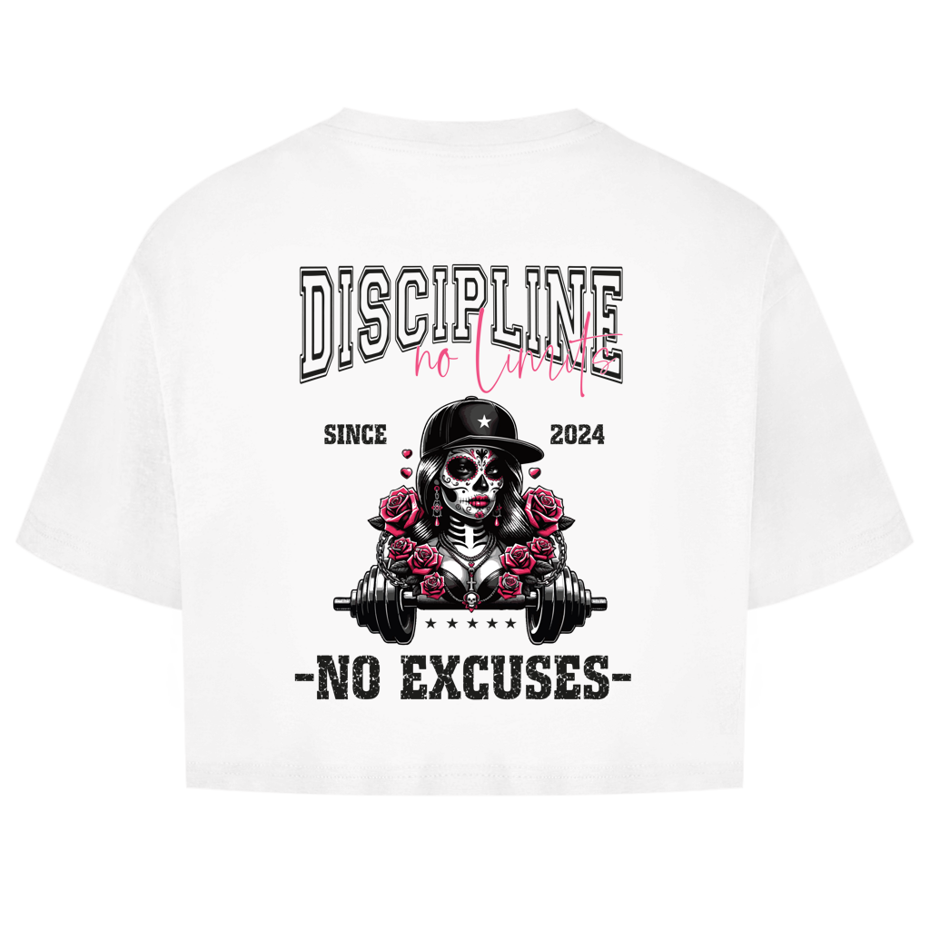 The Oversize Crop Top La Catrina is a white Damen Sportshirt with a graphic of a skull-faced woman in sunglasses and cap, surrounded by roses, holding a barbell. Features the text: DISCIPLINE no limits, SINCE 2024, NO EXCUSES.